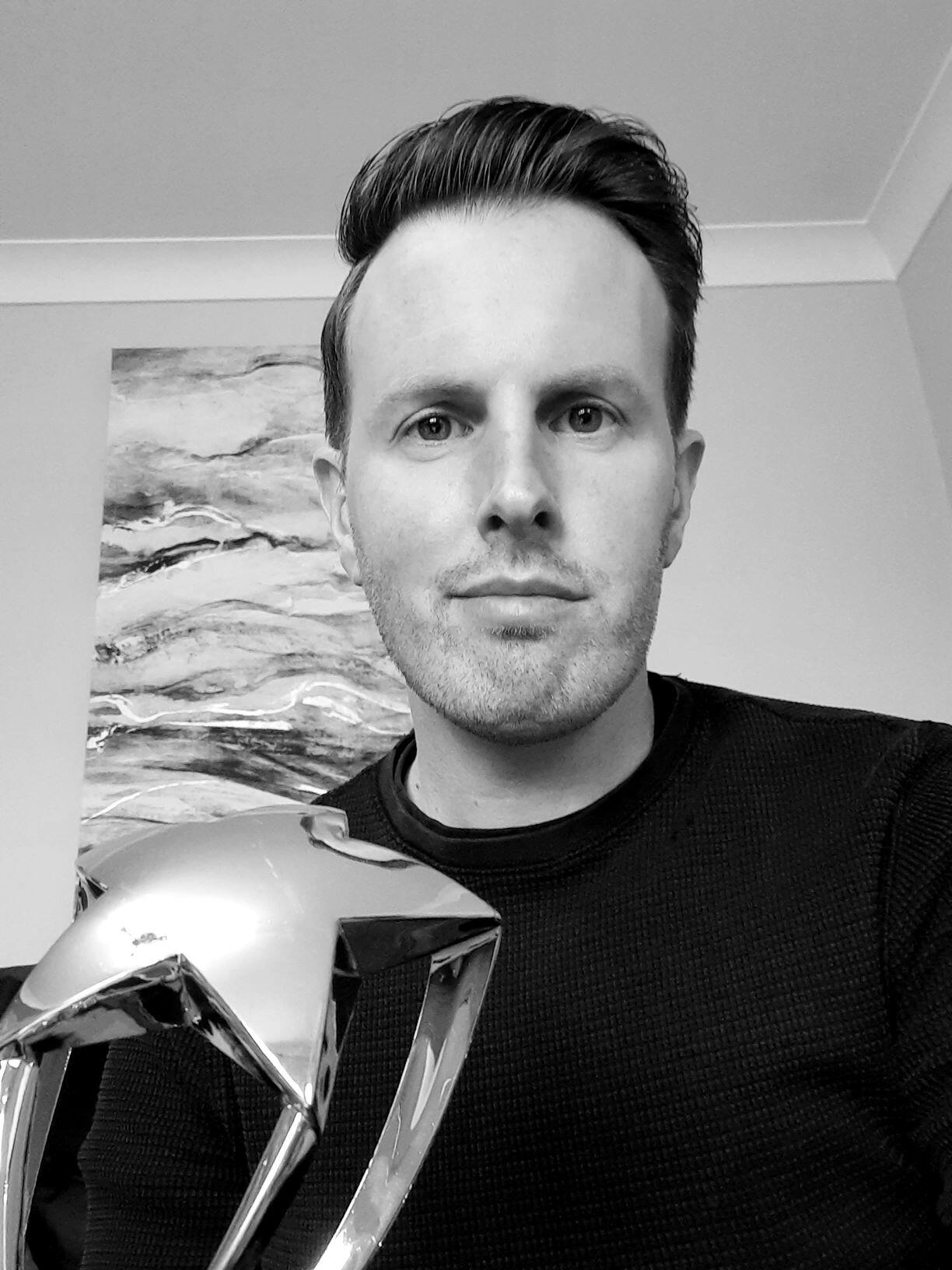 Joel Reed with his Tableau Vizzie award
