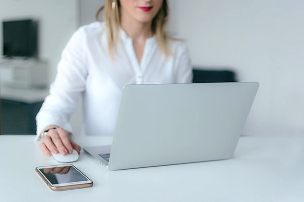 Woman at desk with laptop